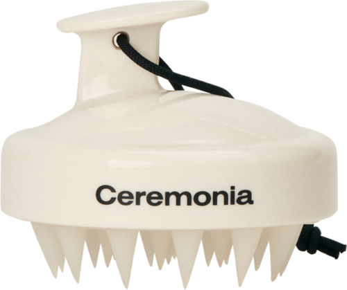 Valkoinen laite, jossa lukee "Ceremonia", rei'itetty alareuna, kahva yläosassa ja virtajohto.