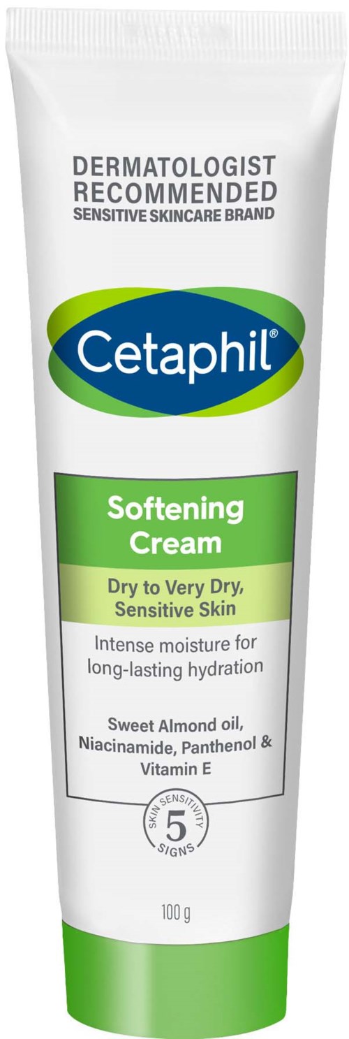 Een witte tube met groene en blauwe labels die aangeven dat het een verzachtende crème is voor droge, gevoelige huid met hydraterende ingrediënten.