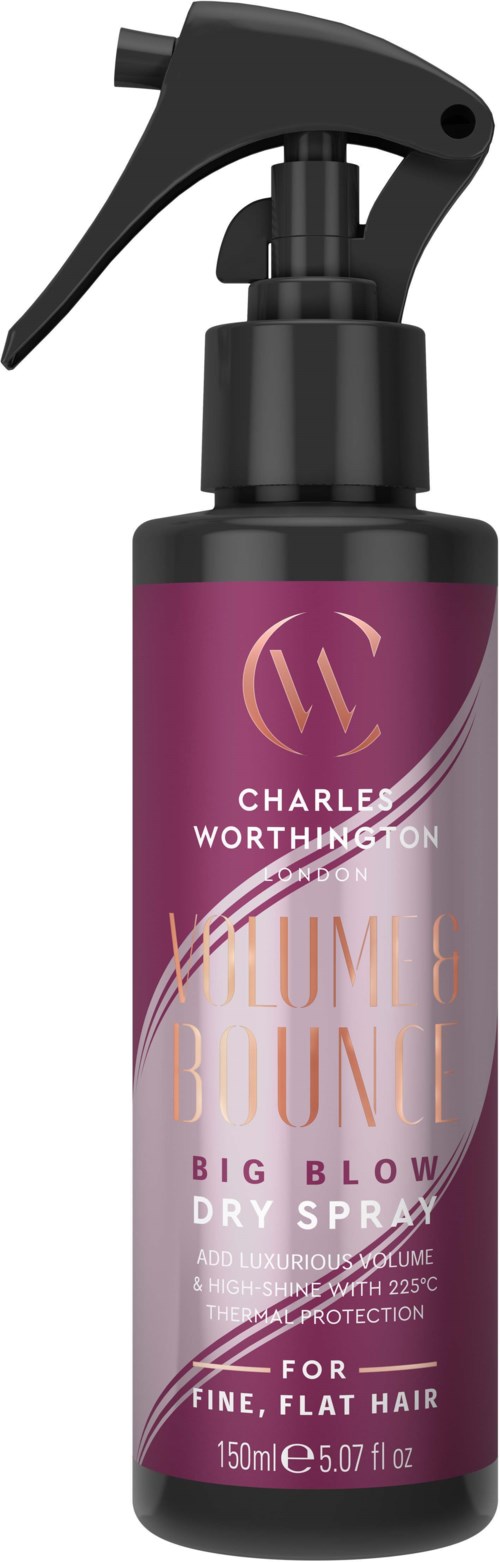 En lila sprayflaska märkt 'Charlie Worthington' för stort hår, med en svart sprayhuvud och lock.