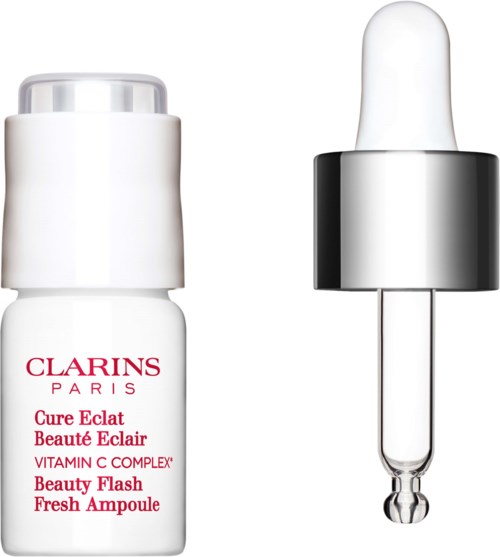 Pieni valkoinen pullo tiputetkella, merkiltä Clarins Paris, ihonhoitoon tai kauneudenhoitoon.
