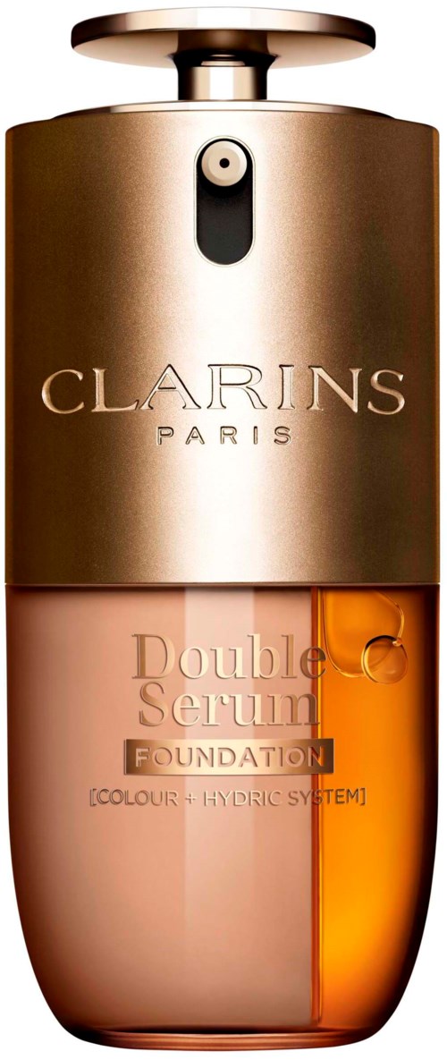 En flaske Clarins Paris Double Serum Foundation med metallhette og ravfarget bunn.