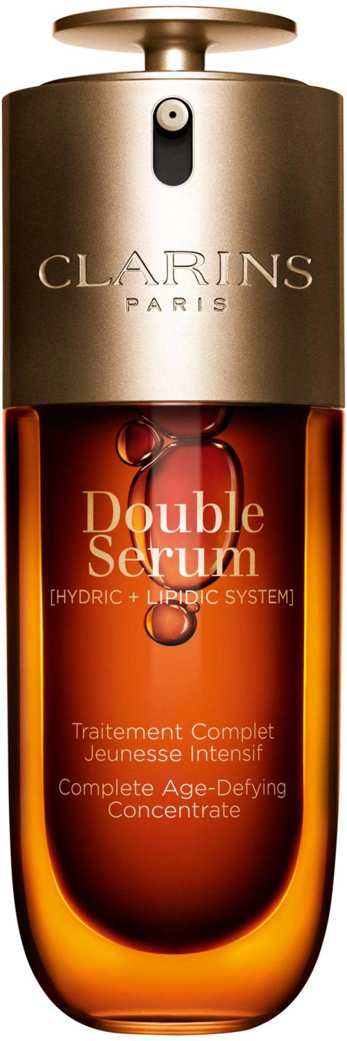 A brown and gold bottle labeled 'Double Serum' by Clarins with a silver top, containing skincare product.