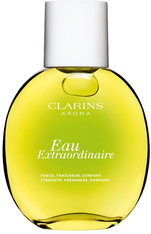 A yellow perfume bottle with a white cap, labeled 'Clarins Aroma Eau Extraordinaire,' and text about freshness and comfort.