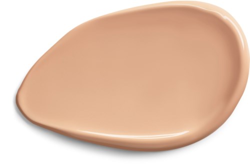 Ett beige kosmetiskt ämne, glatt och lätt böjt, med en glänsande yta, liknar foundation eller concealer.
