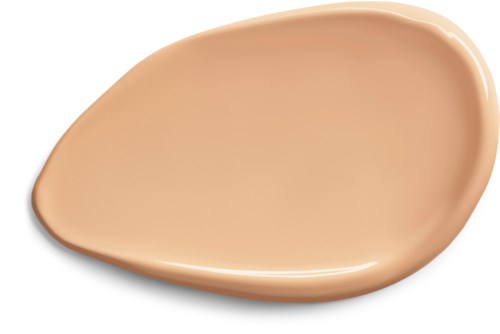 En beige flytande foundation i en platt, oregelbunden form utbredd på svart bakgrund.