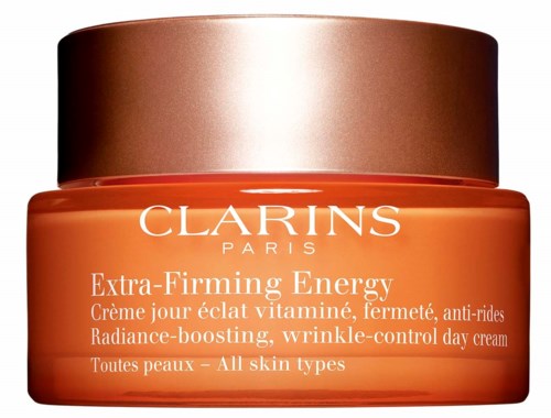 A jar of Clarins Extra-Firming Energy day cream for all skin types, with a brown lid and orange container.