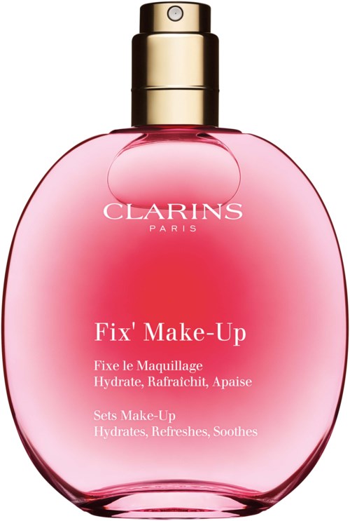 Pink bottle of Clarins Fix' Make-Up spray with a gold pump, labeled as hydrating and soothing.