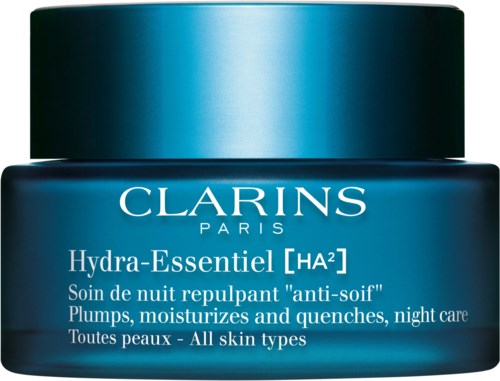 A blue jar of Clarins Hydra-Essentiel night cream, labeled for all skin types, offers moisture and quenching overnight.