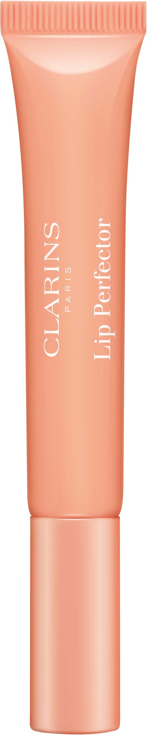 Een perzikkleurige tube met het label CLARINS Lip Perfector staat rechtop.