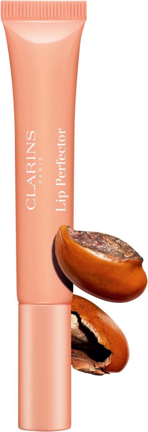 Een perzikkleurige tube met de tekst 'Clarins Lip Perfector' en twee koffiebonen ernaast.