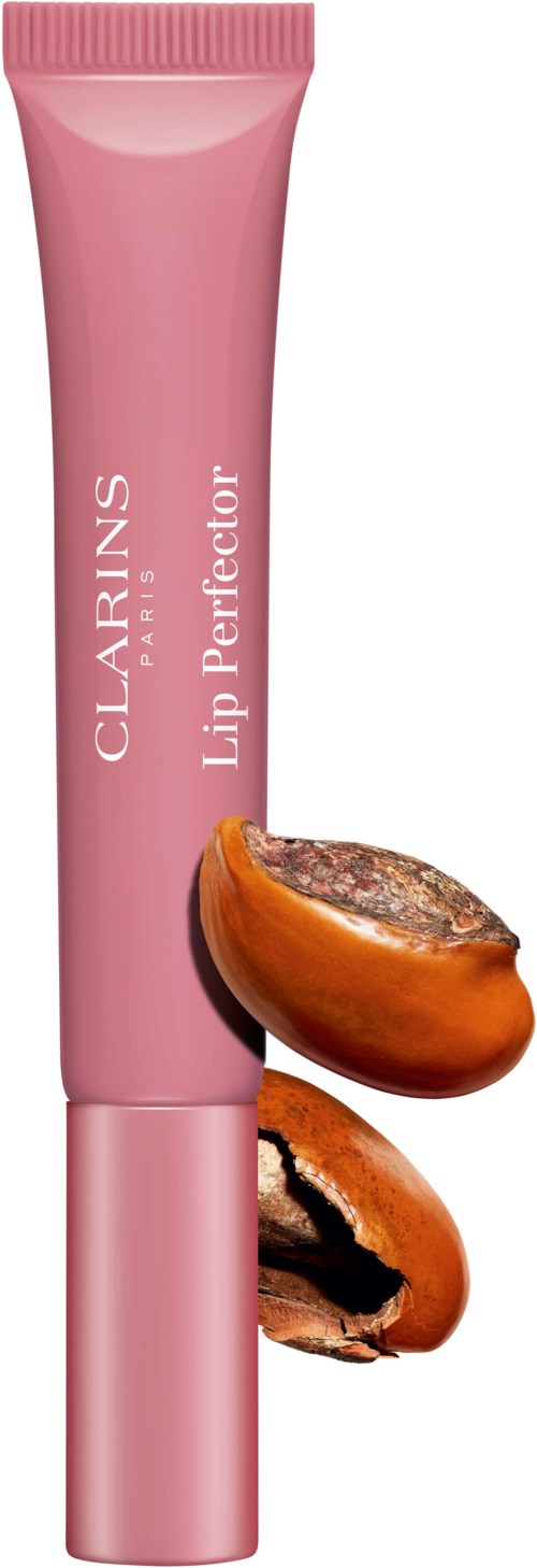 Roze tube van Clarins Lip Perfector met twee bruine, gebroken noten ernaast.