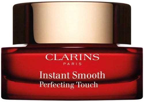 A red jar with a gold cap labeled "Clarins Paris" and "Instant Smooth Perfecting Touch."
