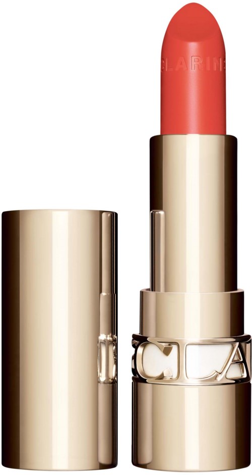 A gold-colored lipstick with the cap removed, showing coral-pink lipstick inside.