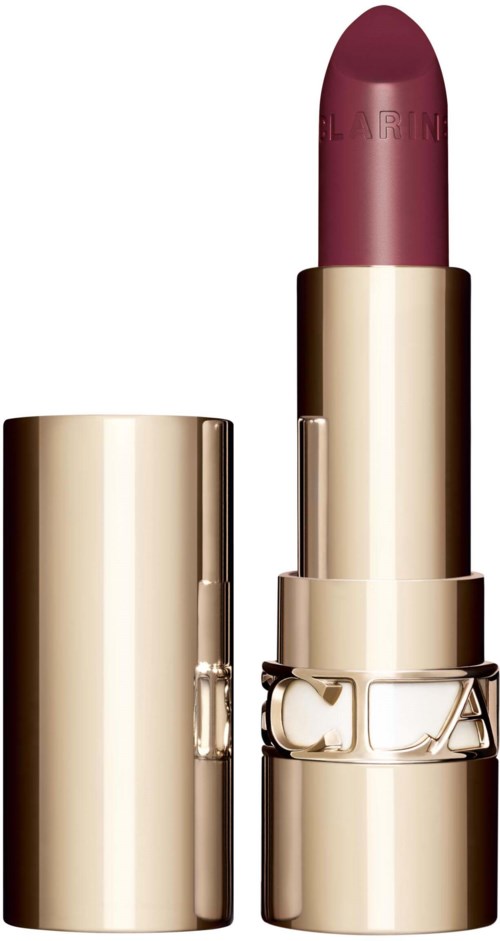 A lipstick in a gold case with a purple color and brand name engraved on the top.