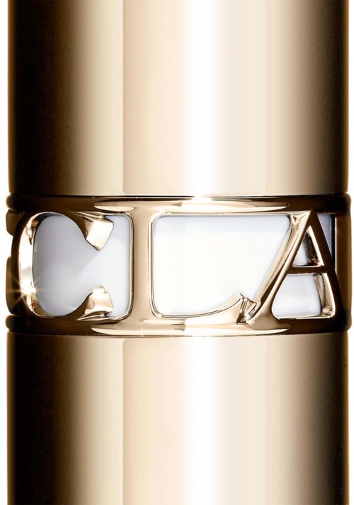 Close-up of a gold ring with the brand name 'YSL' engraved on it.