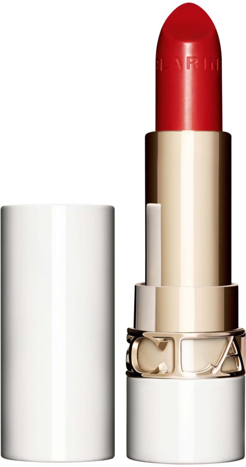 A red lipstick in a white and gold case with the cap removed, showing the lipstick stick. The brand name is faintly visible.