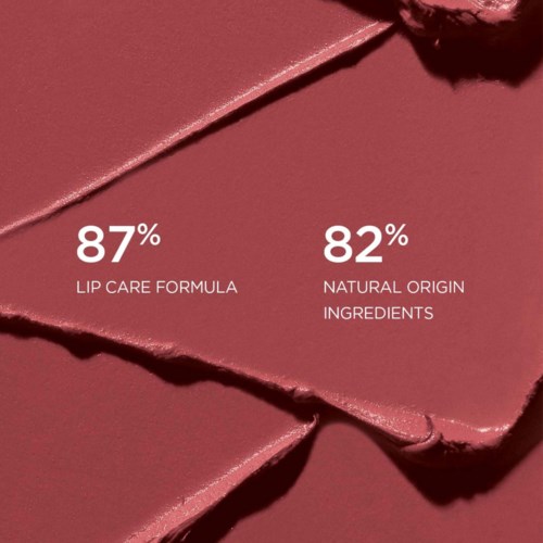 Lip care product highlights 87% formula and 82% natural ingredients. Pink packaging with torn edges.