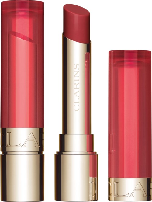 Three red lipsticks with gold and silver cases, one with its cap removed showing the lipstick. Brand name Clarins visible.