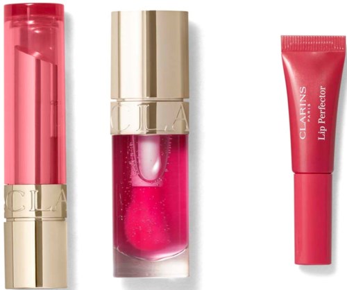 Three lip products in pink and gold packaging: a lipstick, a gloss, and a lip balm.