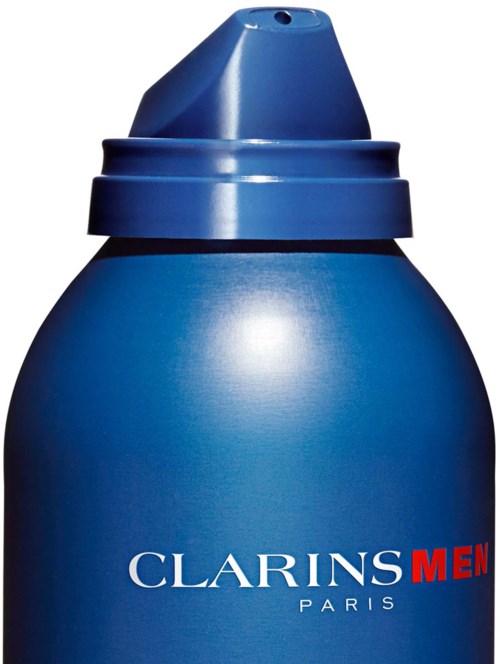 Sininen pullo, jossa lukee "Clarins Men Paris" ja pumpun pää.