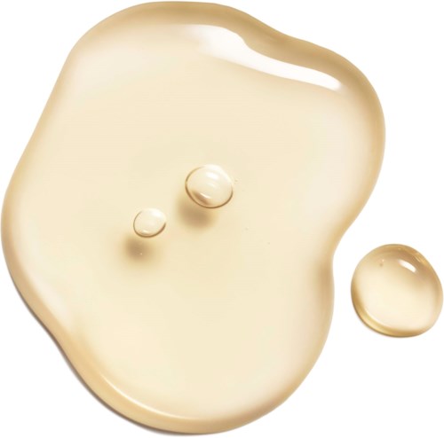 Creamy liquid with two bubbles and a separate small drop nearby.