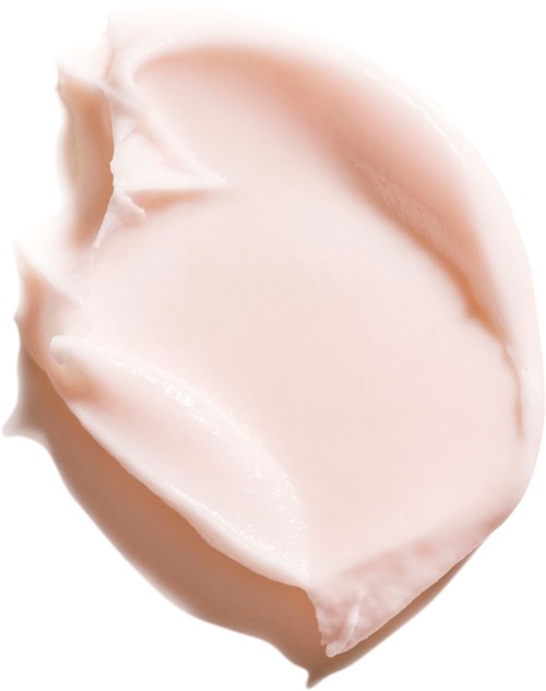 A close-up of a palm-shaped, light-colored soap with a smooth surface and soft edges.
