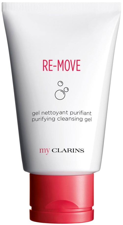 Valkoinen putki, jossa on pinkki korkki, merkitty 'RE-MOVE', käytetään puhdistavaan pesuun. Tuotemerkki on Clarins.