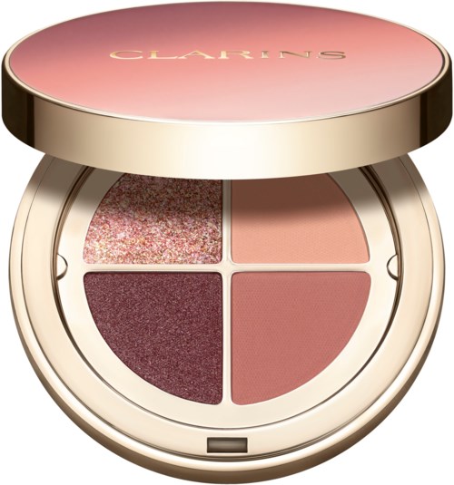 Four makeup blushes and eyeshadows in a round compact with pink and gold colors. The brand is Clarins.