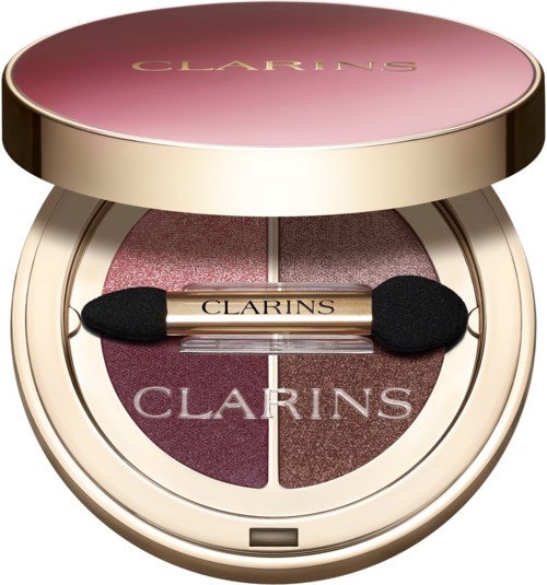 En rund makeup-ombokare med fyra rosa och bruna nyanser, en liten svampapplikator och varumärket 'Clarins'.