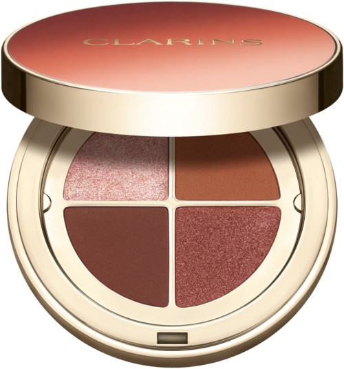 En rund makeup-palett med fyra nyanser av rosa, rött och brunt i ett guld- och persikofäste. Ovan står "CLARINS."
