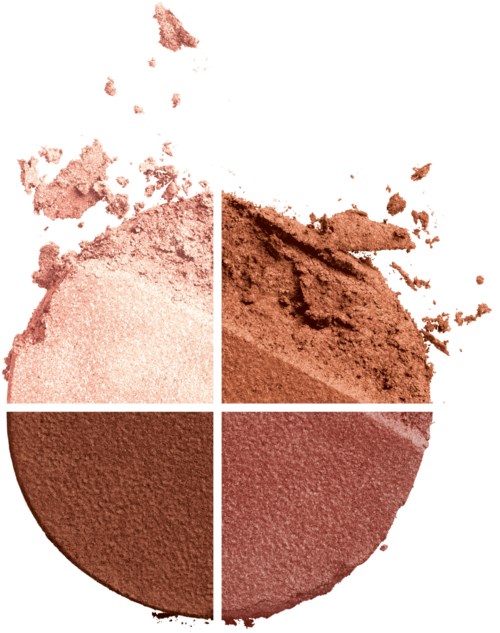Makeuppuder i fyra nyanser, placerade i en cirkel med pulver som spridits runt.