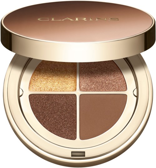 A round makeup palette with four brown and gold eyeshadows, gold lid, and brand name 'Clarins' on top.