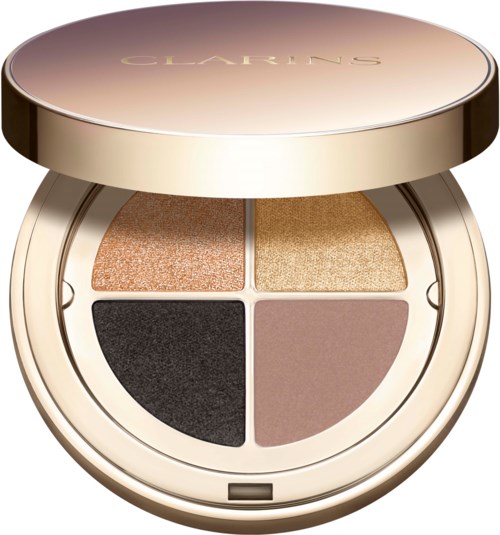 A round makeup compact with four different shades of eyeshadow inside, covered by a shiny lid with the brand name Clairs.