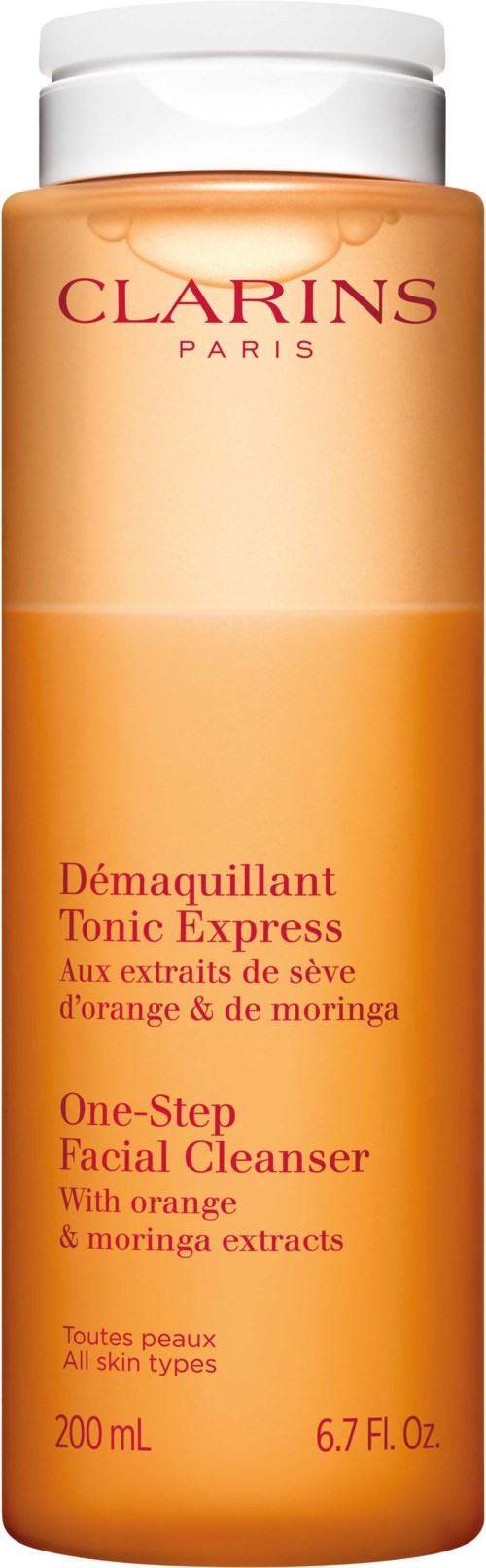 Pitkä, oranssi pullo, jossa lukee Clarins Tonic Express kasvojenpuhdistusaine, valkoinen korkki, kaikille ihotyypeille.