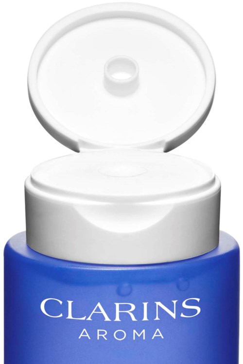 A blue container with a white flip lid, labeled "Clarins Aroma."