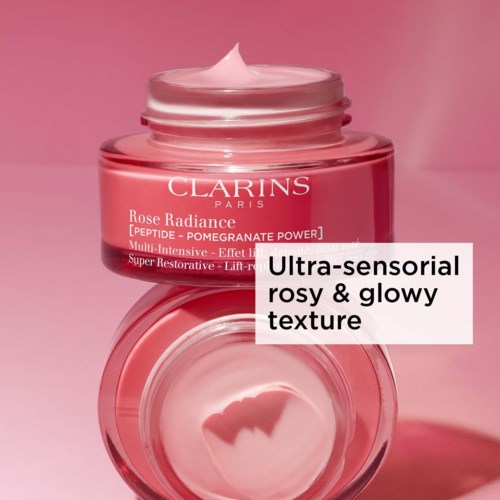 A pink jar of Clarins skincare cream with soft, glowing texture, labeled as brightening and hydrating.