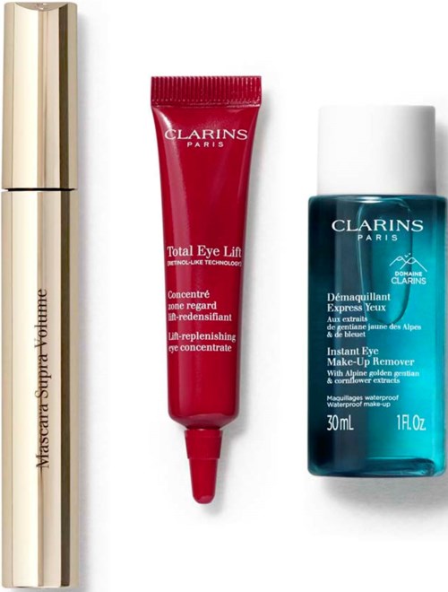 Clarins products including a tube of eye cream and a bottle of makeup remover with white and blue packaging.