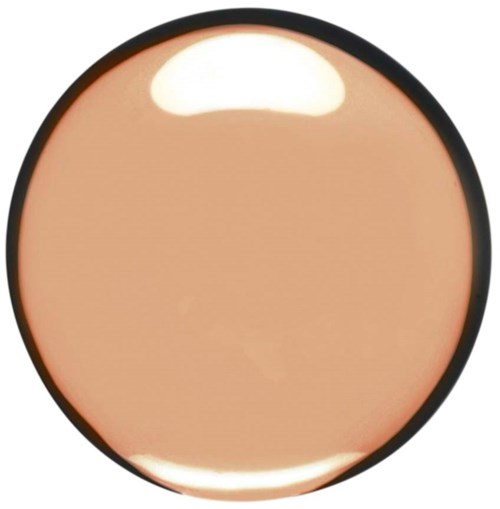A round compact mirror with a beige powder makeup inside.
