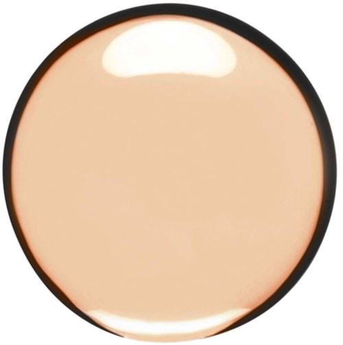 A round makeup compact with beige powder inside, surrounded by a black border.
