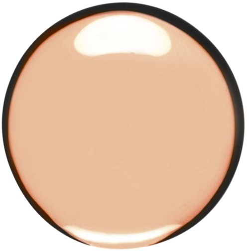 A round makeup sponge with a beige color and black edge showing. It looks soft and smooth.