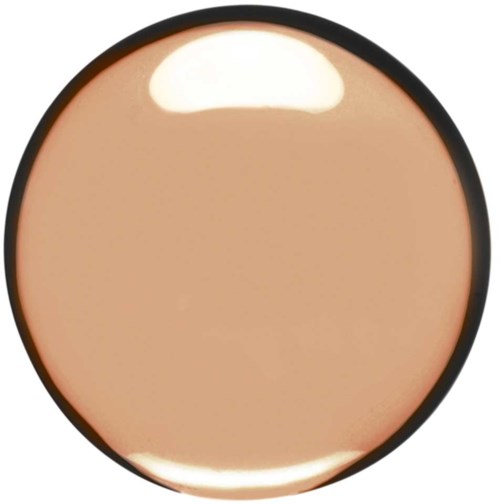 A circular makeup compact with beige powder and a reflective surface on top.