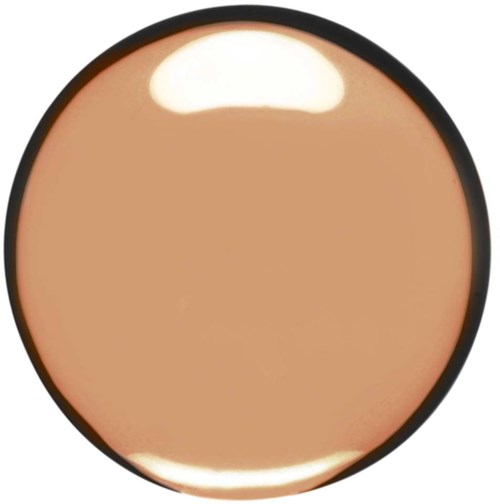 A round makeup compact with beige foundation, showing partial reflection of light. No visible logo or text.