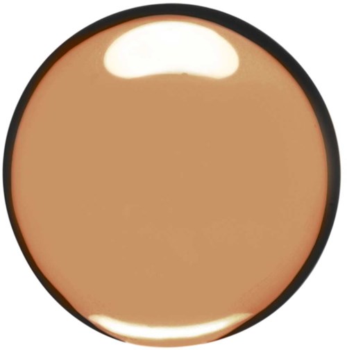 A round makeup compact with beige foundation inside and a black border.