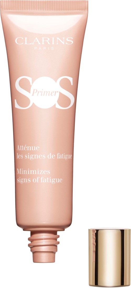 A tube of Clarins SOS Primer, pink color, with gold cap, used to reduce signs of fatigue, labeled with product details.