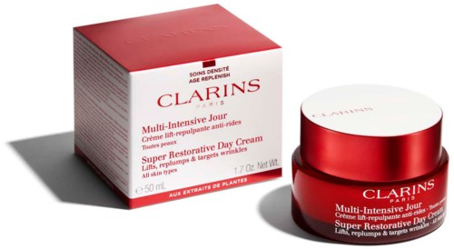 Ein roter und weißer Tiegel und eine Schachtel mit Clarins Hautpflegecreme für empfindliche Haut. Die Schachtel zeigt Produktdetails und Markenname.