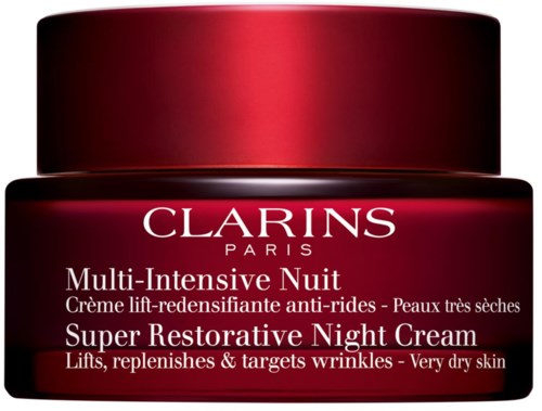 Ein roter Behälter mit Clarins Super Restorative Night Cream für sehr trockene Haut, verspricht Hautstraffung und Faltenminderung.