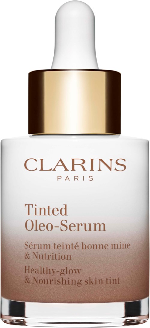 Een witte fles met druppelaar, gouden band en label voor Clarins Tinted Oleo-Serum. Het bevordert een gezonde, stralende en voedende huid.