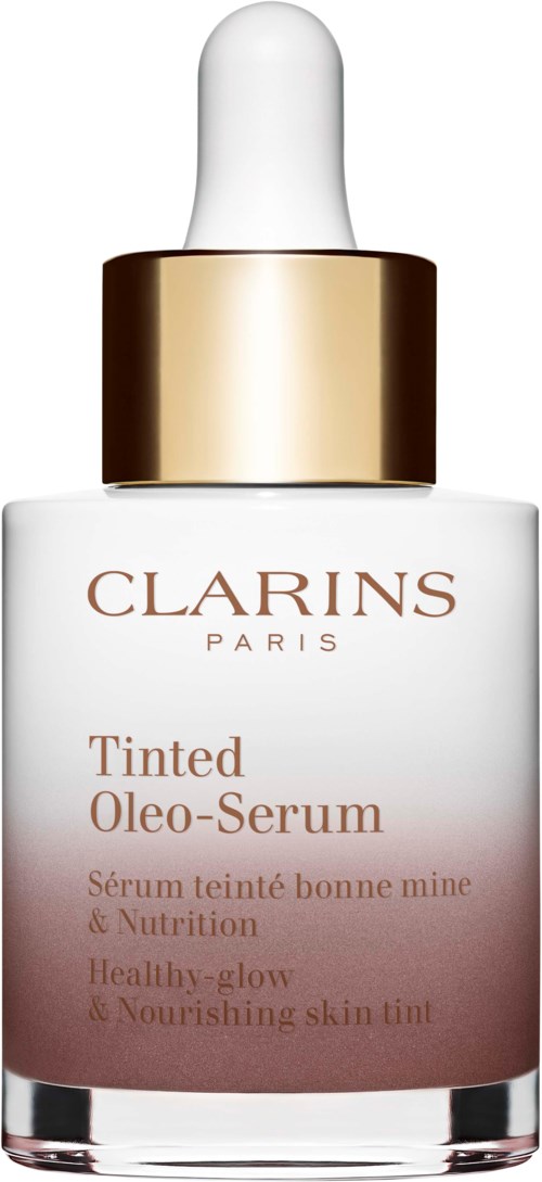 Gouden en witte serumfles met pipet, gemarkeerd 'CLARINS Paris Tinted Oleo-Serum,' voor huidverzorging.