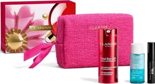 Beauty gift set with Clarins skincare products in a pink bag, including cream, serum, and eye lift.