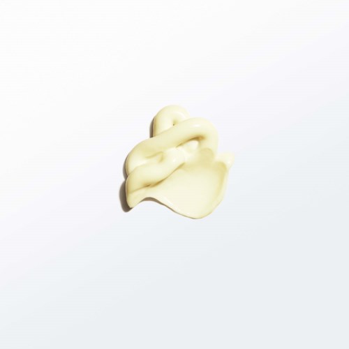 A small, twisted, cream-colored sculpture or object on a white background.